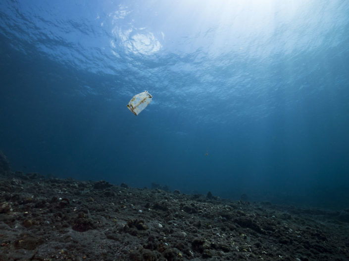 Plastic bag floating on an empty reef in Indonesia.